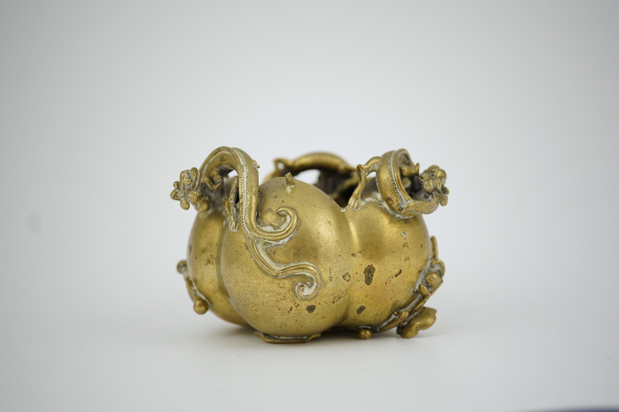 A large Chinese bronze rectangular censer and cover, Xuande seal mark, and a ‘plum blossom and chilong’ bronze censer, both 19th century